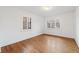 Bright bedroom with hardwood floors and natural light from windows at 265 S Pennsylvania St, Denver, CO 80209