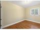 Bedroom with hardwood floors, light walls, and natural light at 265 S Pennsylvania St, Denver, CO 80209