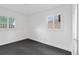 Cozy bedroom with carpet flooring, white walls, and two windows at 265 S Pennsylvania St, Denver, CO 80209