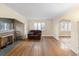 Bright living room with hardwood floors, fireplace and large windows at 265 S Pennsylvania St, Denver, CO 80209