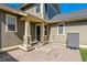 Backyard patio with a covered porch and exterior home features at 2626 Tamarac St, Denver, CO 80238