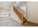 Spacious basement with carpet, stairs, and natural light, creating a versatile living space at 2626 Tamarac St, Denver, CO 80238