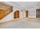 Finished basement with built in bookcase and open floor plan at 2626 Tamarac St, Denver, CO 80238