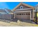 Exterior shot of a two car garage and driveway at 2626 Tamarac St, Denver, CO 80238