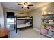 Bedroom with bunk beds, a side table and a bookcase with various decorations at 15869 E Otero Ave, Centennial, CO 80112