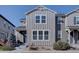 A well-maintained two-story home with modern siding and a manicured front yard at 15869 E Otero Ave, Centennial, CO 80112