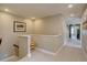 Upstairs hallway with neutral colored carpet, paint and white trim at 15869 E Otero Ave, Centennial, CO 80112