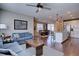 Open living room and kitchen and dining layout featuring hardwood floors and recessed lighting at 15869 E Otero Ave, Centennial, CO 80112