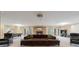 Spacious basement with a large sectional couch, a stone fireplace, ping pong table and media projector at 67 Indigo Way, Castle Rock, CO 80108