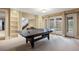 Basement featuring a ping pong table, built in bookshelves, and french doors leading to the outside at 67 Indigo Way, Castle Rock, CO 80108