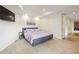 Comfortable bedroom with light purple linens, soft carpet, and modern decor at 67 Indigo Way, Castle Rock, CO 80108