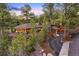 Elegant home with a private driveway, surrounded by mature trees and a beautifully landscaped yard at 67 Indigo Way, Castle Rock, CO 80108
