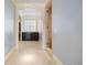 Hallway view leading to a bathroom with a shower, tub, and linen closet at 67 Indigo Way, Castle Rock, CO 80108