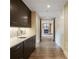 Hallway featuring a kitchenette and leading to the fireplace in the living room at 67 Indigo Way, Castle Rock, CO 80108