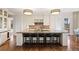 Elegant kitchen features granite countertops, a large island, and modern stainless steel appliances at 67 Indigo Way, Castle Rock, CO 80108