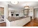 Gourmet kitchen features a large island with views of the living room and a cozy fireplace at 67 Indigo Way, Castle Rock, CO 80108