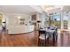 Open-concept living area with a fireplace, hardwood floors, and elegant dining space at 67 Indigo Way, Castle Rock, CO 80108