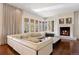 Bright living room with a fireplace and a large window overlooking the property at 67 Indigo Way, Castle Rock, CO 80108