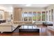 Bright and airy living room with hardwood floors and a view of the surrounding neighborhood at 67 Indigo Way, Castle Rock, CO 80108