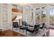 Elegant living room with a winding staircase, large windows, and stylish seating at 67 Indigo Way, Castle Rock, CO 80108