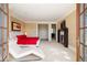 Spacious main bedroom with fireplace, deck access, and a chaise lounge for relaxing at 67 Indigo Way, Castle Rock, CO 80108