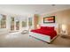 Main bedroom with a private balcony, large windows, and elegant furnishings at 67 Indigo Way, Castle Rock, CO 80108