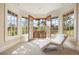 Bright sitting room with floor-to-ceiling windows and French doors leading to a private balcony at 67 Indigo Way, Castle Rock, CO 80108