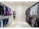Spacious walk-in closet with ample hanging space and organized shelving for clothing and accessories at 67 Indigo Way, Castle Rock, CO 80108