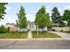 Charming single-story home with a well-maintained lawn, mature trees, and a quaint walkway leading to the front door at 5740 S Cherokee St, Littleton, CO 80120