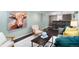 Charming living room featuring stylish furnishings, dark wood floors, and an artistic touch for a modern living space at 5740 S Cherokee St, Littleton, CO 80120