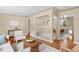 Open living space with hardwood floors, stylish seating, and decorative archways leading to adjacent rooms at 5740 S Cherokee St, Littleton, CO 80120