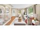 Bright living room with hardwood floors, neutral decor, and large windows offering ample natural light at 5740 S Cherokee St, Littleton, CO 80120