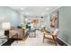 Stylish living room featuring recessed lights, built-in shelving, comfortable seating, and modern decor for entertaining at 5740 S Cherokee St, Littleton, CO 80120