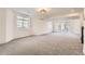 A well-lit, spacious basement with neutral walls, recessed lighting, and gray carpet at 15705 Red Deer Dr, Morrison, CO 80465