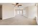 Bright bedroom with neutral carpet, ceiling fan and multiple windows at 15705 Red Deer Dr, Morrison, CO 80465