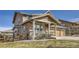 Beautiful exterior showcasing the home's architectural design, with a inviting covered porch and well-maintained landscaping at 15705 Red Deer Dr, Morrison, CO 80465