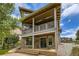 Beautiful home exterior featuring a stone facade, outdoor patio, and lovely second story balcony at 15705 Red Deer Dr, Morrison, CO 80465