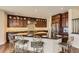 Gourmet kitchen featuring a large granite island, stainless steel appliances, and custom cabinets for the discerning chef at 15705 Red Deer Dr, Morrison, CO 80465