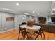 Finished basement features a cozy fireplace, a game table, and a comfortable seating area at 6330 Montview Blvd, Denver, CO 80207