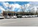 Street view of a one-story brick commercial building with parking and many different businesses at 6330 Montview Blvd, Denver, CO 80207
