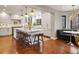 Bright kitchen features a large island, pendant lighting, modern appliances, and a cozy eat-in area at 6330 Montview Blvd, Denver, CO 80207