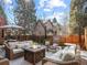 Cozy backyard patio features a fire pit surrounded by comfortable seating, ideal for outdoor entertaining at 6330 Montview Blvd, Denver, CO 80207