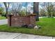 Park Hill brick neighborhood sign with landscaping, green grass, and bike lane at 6330 Montview Blvd, Denver, CO 80207