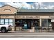 Street view of Park Hill retail buildings featuring businesses like a bakery, ice cream, coffee shop, and dance academy at 6330 Montview Blvd, Denver, CO 80207