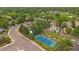 Aerial view of a community featuring a pool, tennis court and tree-lined streets at 6936 S Knolls Way, Centennial, CO 80122