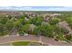 Beautiful residential area with mature trees, crosswalks, and a glimpse of mountains in the distance at 6936 S Knolls Way, Centennial, CO 80122