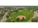 Aerial view of a neighborhood park featuring baseball fields and walking path at 6936 S Knolls Way, Centennial, CO 80122