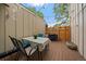 Enjoy this outdoor patio with dining set, string lights, and charming butterfly decor at 6936 S Knolls Way, Centennial, CO 80122