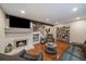 Cozy living room showcases a fireplace, hardwood floors, modern furniture, and recessed lighting, creating a warm ambiance at 6936 S Knolls Way, Centennial, CO 80122