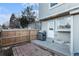 Cozy back patio with a grill, perfect for outdoor cooking and entertaining with a wooden fence at 1100 S Waco St # G, Aurora, CO 80017